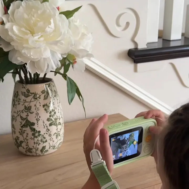 Child using Dr.Look AI Cap to explore flowers indoors